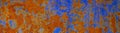 Rusty metal plate background. Bright orange blue abstract background. Old rusty painted wall surface. Royalty Free Stock Photo