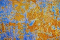 Rusty metal plate background. Orange blue abstract grunge texture background. Old rusty painted wall surface Royalty Free Stock Photo