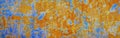 Rusty metal plate background. Wide banner. Orange blue abstract grunge texture background. Old rusty painted wall surface Royalty Free Stock Photo