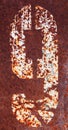 Rusty metal plate with digit nine