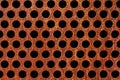 Rusty metal plate with holes isolated on black Royalty Free Stock Photo