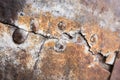 Rusty metal plate with a seam and rivets Royalty Free Stock Photo