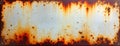 Rusty metal plate shows corrosion, oxidation. Rusty surface texture. Aged metal surface displays deep rust patterns. Close-up