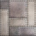 Rusty metal plates with rivets seamless background or texture Royalty Free Stock Photo