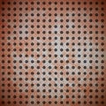 Rusty metal with rivet grid