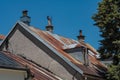 Rusty metal roof and a man figure on the chimney Royalty Free Stock Photo