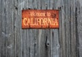 Rusty metal sign with the phrase: Welcome to California. Royalty Free Stock Photo