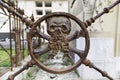 Rusty metal skull in a cemetery