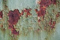 Rusty metal surface with cracked green paint, abstract rusty metal texture, rusty metal background for design with copy space, cor Royalty Free Stock Photo