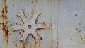 rusty metal surface with grey shabby paint. metal snowflake Royalty Free Stock Photo