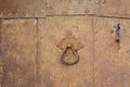 Rusty metal surface with rivets and door handle Royalty Free Stock Photo