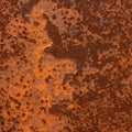 Rusty metal surface with a rough texture and a pattern of flaking iron oxide. The Royalty Free Stock Photo