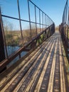 Suspended pedestrian bridge over small river Sura in ukraine