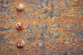 Rusty metal texture with bolts. Background of old vintage steel structure with rivets Royalty Free Stock Photo