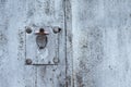 Rusty metal texture with covered keyhole, scratches and cracks. Paint traces. Blue, white and grey colors. Copy space Royalty Free Stock Photo