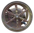 Rusty metal vintage wheel from an retro agricultural motor and machinery with moss spots isolated