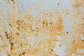 Rusty metal wall with cracked blue paint, rust through the paint Royalty Free Stock Photo