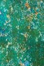 Rusty metal wall, old iron sheet, covered with rust with multi-colored paint. Trace of remnant of old paint in large deep crack on Royalty Free Stock Photo