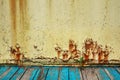 Rusty metal wall, old sheet of iron covered with rust with multi-colored paint. Large cracks. ÃÅ¾ld Rusty metal background Royalty Free Stock Photo