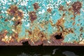 Rusty metal wall, old sheet of iron covered with rust with multi-colored paint. Large cracks. ÃÂÃÂ¾ld Rusty metal background Royalty Free Stock Photo