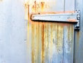 Rusty metallic hinge on door Royalty Free Stock Photo