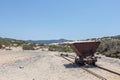 Rusty mining cart on abandoned desert rail track Royalty Free Stock Photo
