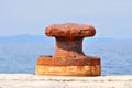 Rusty mooring bollard on port of Podgora Royalty Free Stock Photo