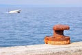 Rusty mooring bollard on port of Podgora Royalty Free Stock Photo