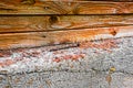 Rusty nail lies on the concrete foundation of a wooden house Royalty Free Stock Photo