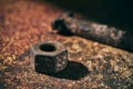 Rusty nut and bolt on a rusty surface Royalty Free Stock Photo