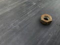 rusty nuts unused on a gray background in the barn Royalty Free Stock Photo