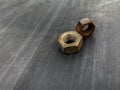 rusty nuts unused on a gray background in the barn Royalty Free Stock Photo