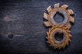 Rusty obsolete rotary cutters on wooden surface