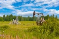 Rusty oil pump, stopping oil production at a field in Russia Royalty Free Stock Photo