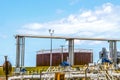 Rusty oil tank at tank farm in Cushing Oklahoma with valves and pipes and overhead rail at pipeline loading facility where most of Royalty Free Stock Photo