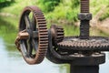 Rusty and oily water gate gear. Royalty Free Stock Photo