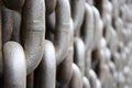 Rusty old brown Iron chains, background. Wall of hanging vertically massive chains. Close-up Royalty Free Stock Photo