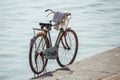 Rusty old bycicle parked on the edge of the holy rive Ganges in Varanasi, India Royalty Free Stock Photo