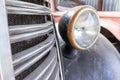 A rusty old car front headlight close up Royalty Free Stock Photo