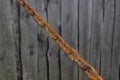 Old rusty chain on a gray wooden background Royalty Free Stock Photo