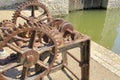 Rusty old cog wheels and pulleys