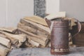 A rusty old dirty cup against pieces of wood Royalty Free Stock Photo