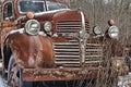 Rusty old dodge truck lies abandoned