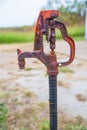 Rusty old farm hand water pump Royalty Free Stock Photo