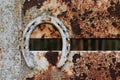 Rusty old horseshoe on trailer