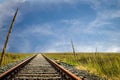 Rusty old iron train tracks running through the prarie to the horizon Royalty Free Stock Photo