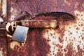 Rusty old lock on red grungy background, textplace. Royalty Free Stock Photo