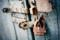 A rusty old lock on a wooden door Royalty Free Stock Photo