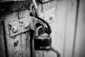 A rusty old lock on a wooden door Royalty Free Stock Photo