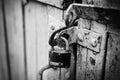 A rusty old lock on a wooden door Royalty Free Stock Photo